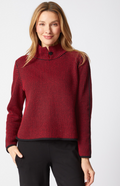 Woman wearing a red night & day button collar pullover on a white background